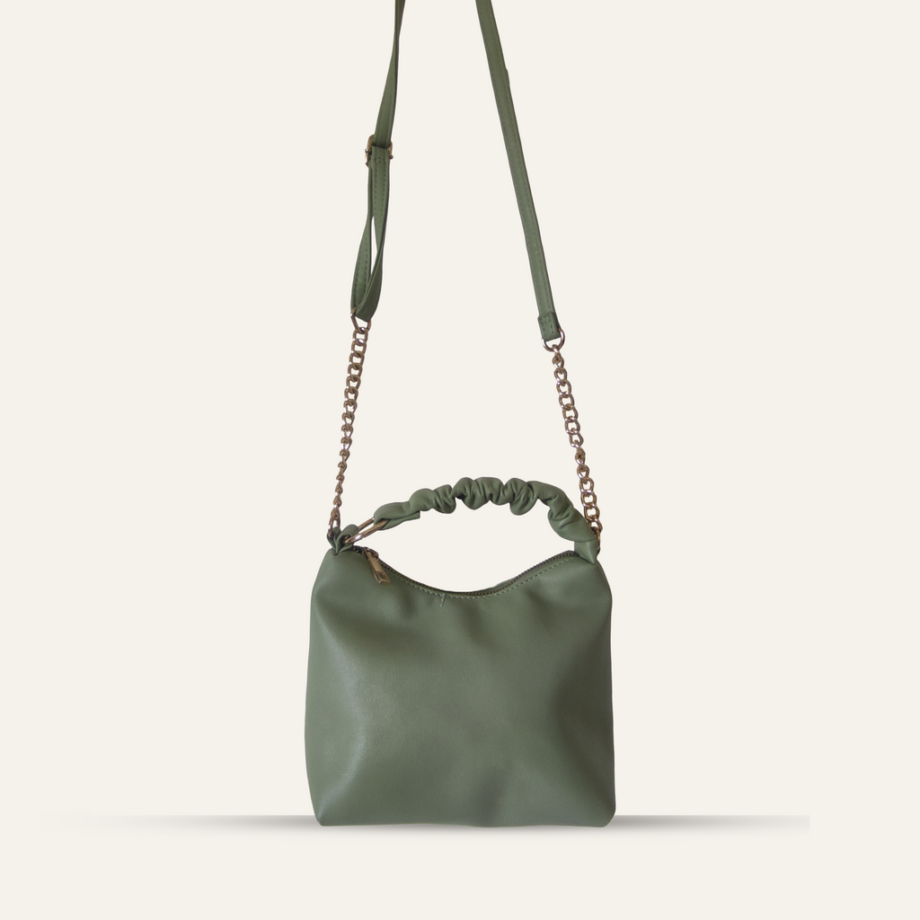 Green handbag with chain strap on a white background